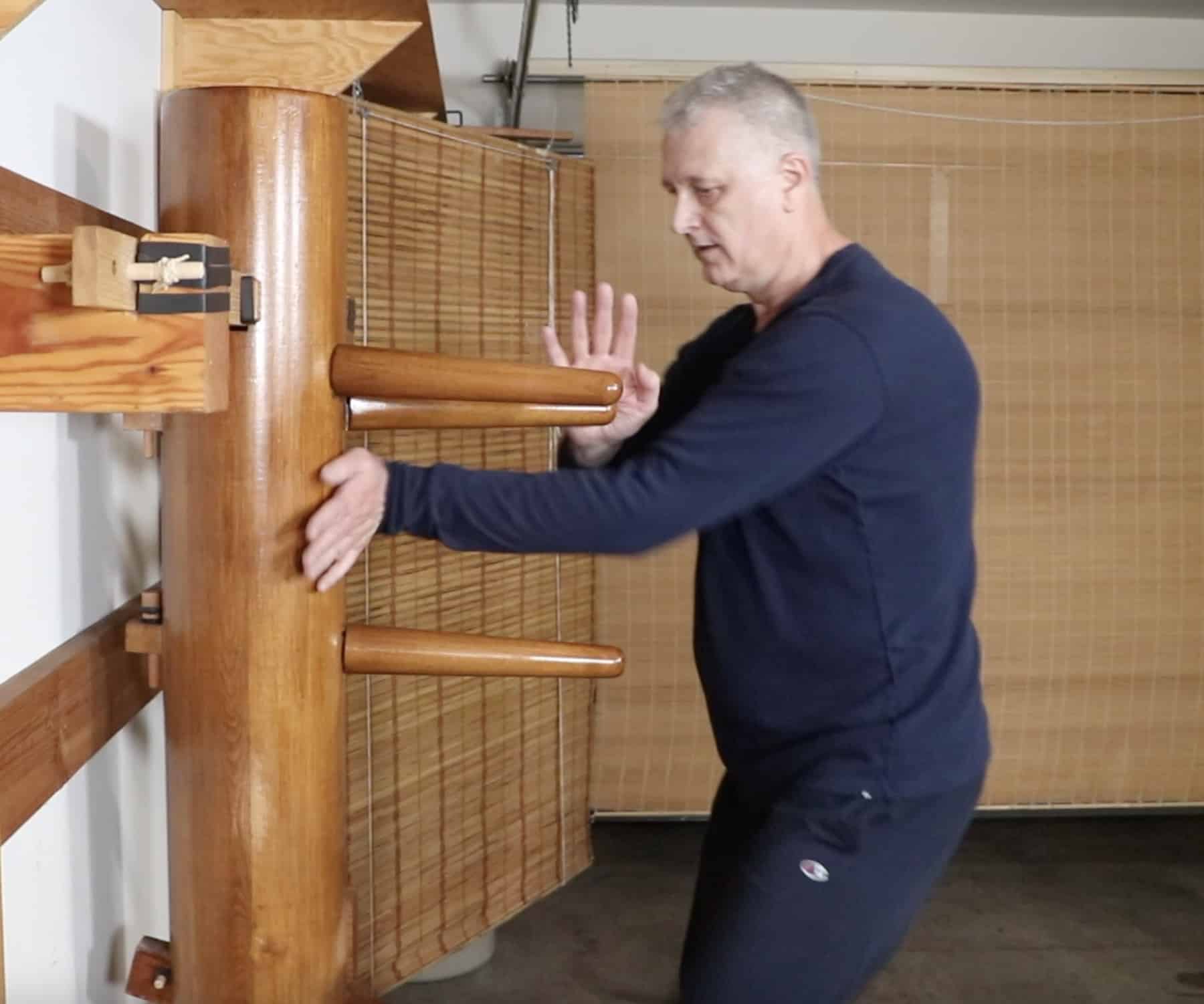 Branko Knezevic performing Pak Sao with laying palm counter-strike on the Wing Chun wooden dummy