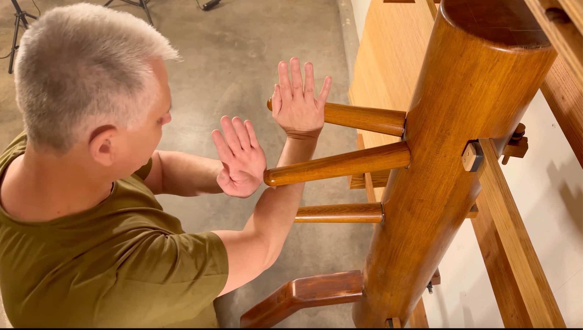 Branko Knezevic demonstrating Pak Sao technique on the Wing Chun wooden dummy