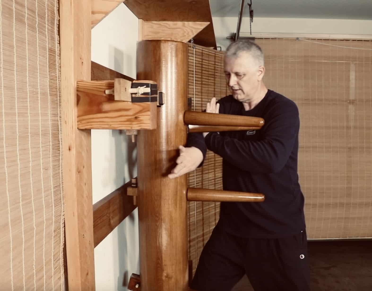 Branko Knezevic performing a movement from the traditional Mook Yan Jong wooden dummy form in Wing Chun.